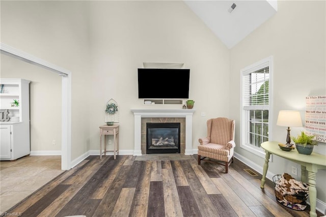 7255 Orchard Path Dr, Clemmons, NC 27012 - living area featuring high vaulted ceiling, wood finished floors, a fireplace, and baseboards