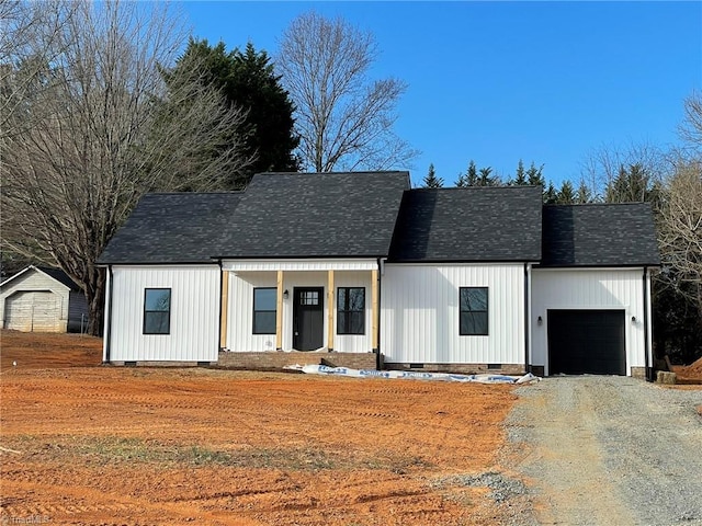 modern farmhouse with crawl space, driveway, an attached garage, and roof with shingles