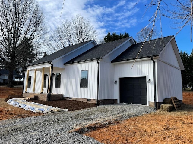 view of front of property with a shingled roof, crawl space, driveway, and an attached garage