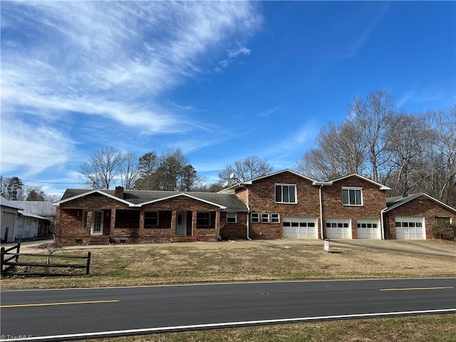 view of front of property with a garage and a front yard