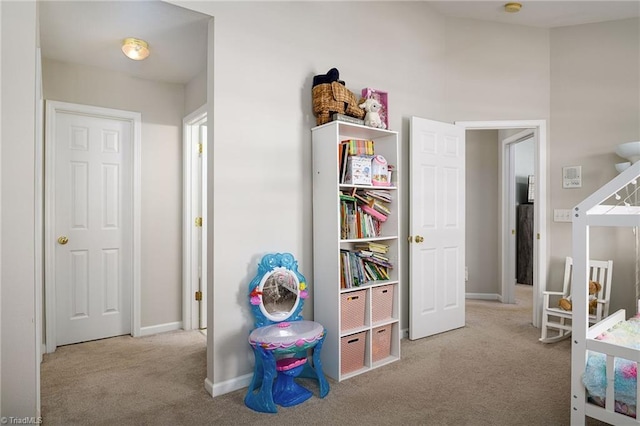 playroom featuring carpet flooring and baseboards