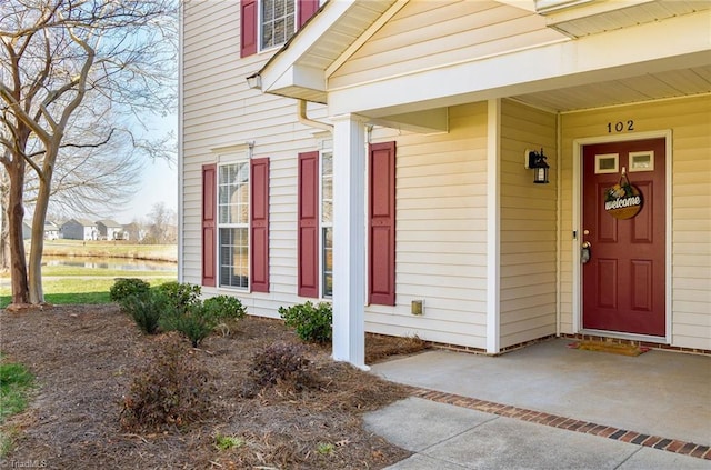 property entrance featuring a water view