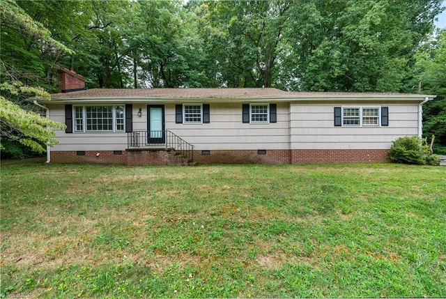 ranch-style house with a front lawn