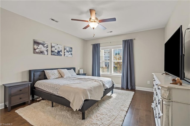 bedroom featuring dark hardwood / wood-style flooring and ceiling fan