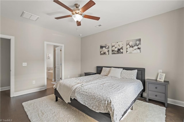 bedroom featuring ensuite bath, ceiling fan, and dark hardwood / wood-style floors