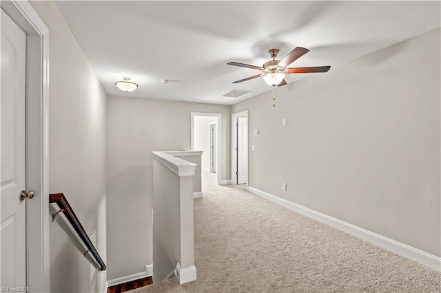 corridor with carpet flooring