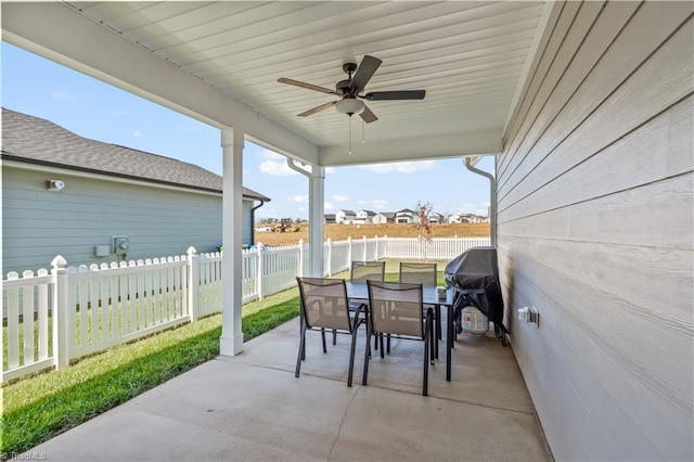 view of patio featuring ceiling fan and a grill