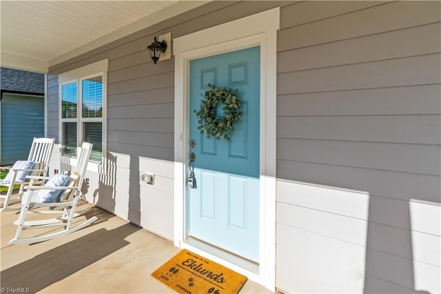 property entrance featuring a porch