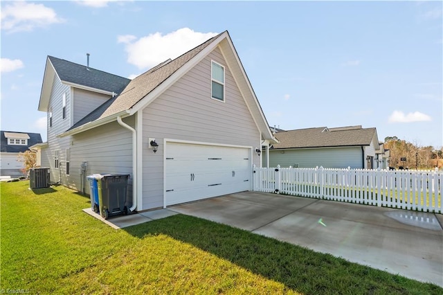 view of side of home featuring a lawn and central AC unit