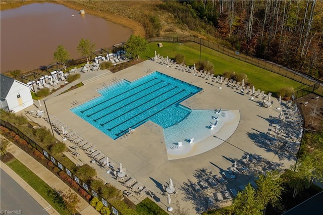 view of swimming pool with a water view