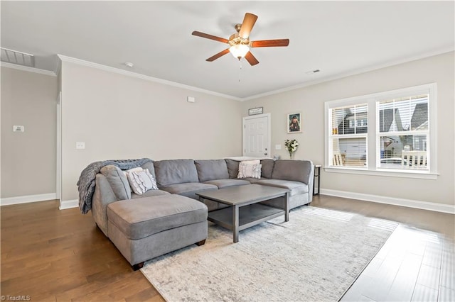 living room with hardwood / wood-style flooring, ceiling fan, and crown molding