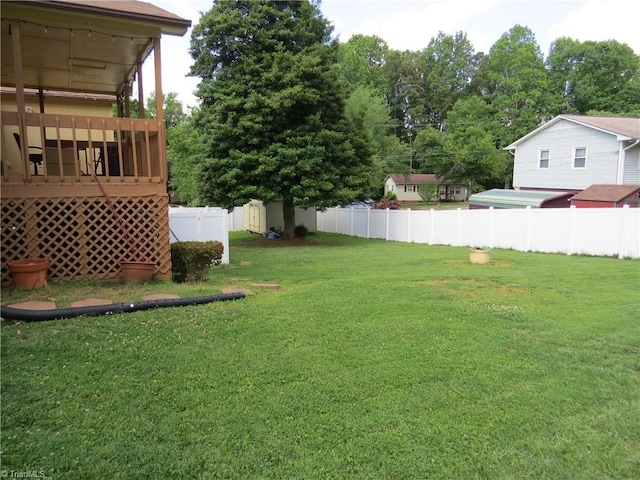 view of yard featuring a shed and an outbuilding