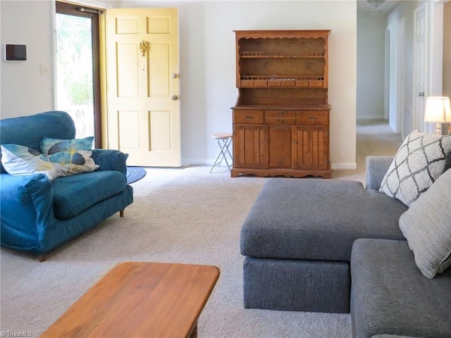 living area with carpet and baseboards