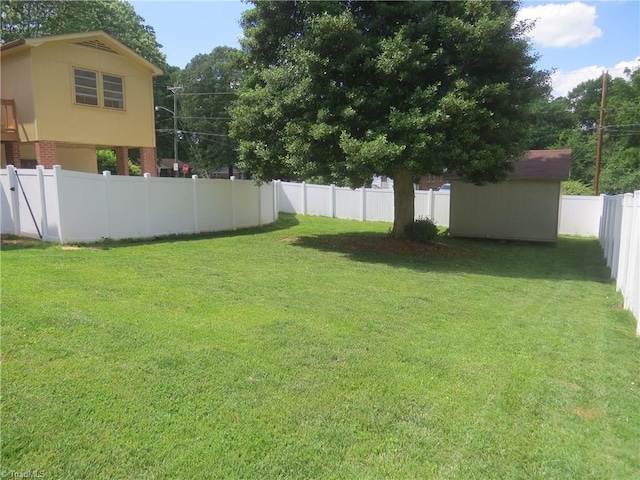 view of yard featuring an outbuilding and a storage shed
