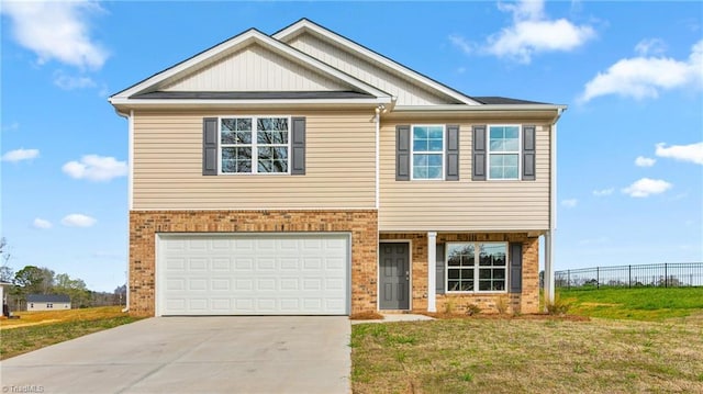 view of front of home featuring a garage and a front yard