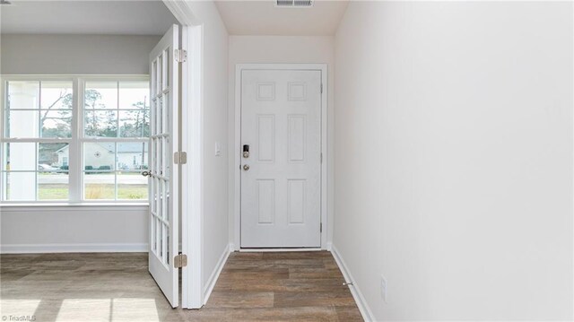 doorway to outside with hardwood / wood-style floors