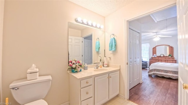 138 Wyndham Ct, High Point, NC 27265 - ensuite bathroom featuring toilet, vanity, a textured ceiling, and a ceiling fan