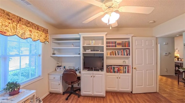138 Wyndham Ct, High Point, NC 27265 - office area featuring ceiling fan, a textured ceiling, light wood-style flooring, and built in desk