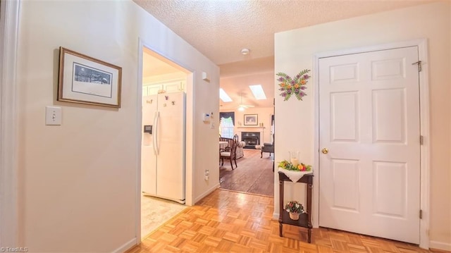 138 Wyndham Ct, High Point, NC 27265 - foyer with a textured ceiling, baseboards, a skylight, and a fireplace