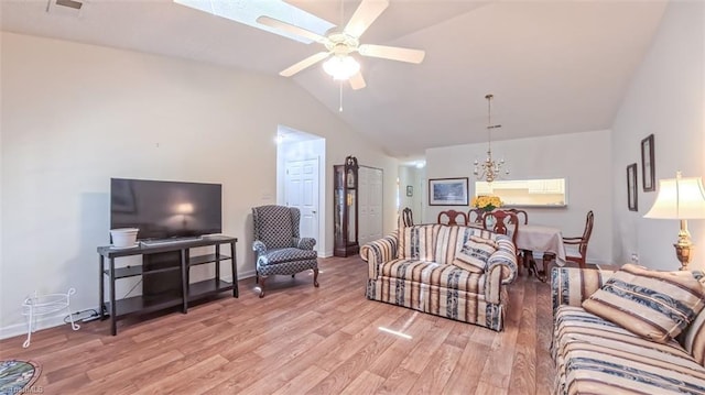 138 Wyndham Ct, High Point, NC 27265 - living area with lofted ceiling, wood finished floors, a chandelier, ceiling fan, and baseboards