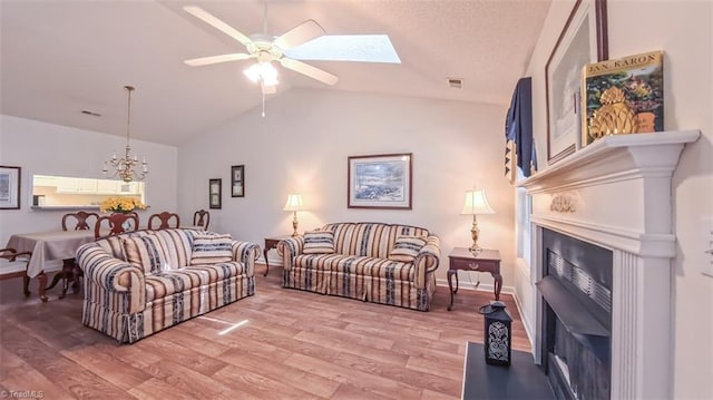 138 Wyndham Ct, High Point, NC 27265 - living area with a fireplace, lofted ceiling, baseboards, and light wood finished floors