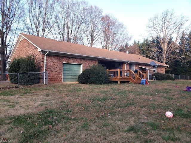 exterior space featuring a deck and a garage