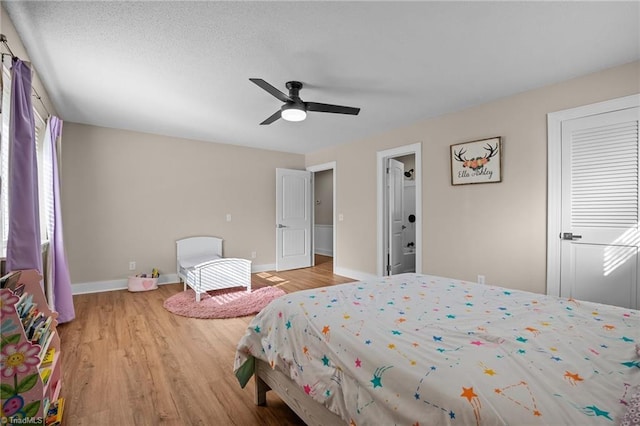 bedroom featuring ceiling fan and light wood-type flooring