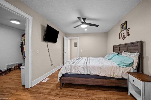 bedroom featuring ceiling fan and wood-type flooring