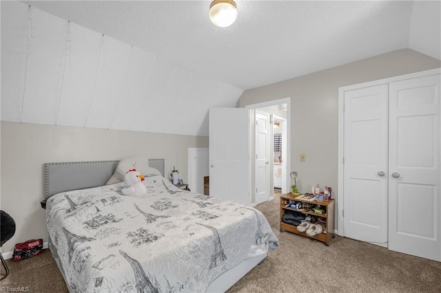 5001 Robert Andrew Rd, Greensboro, NC 27406 - bedroom featuring lofted ceiling, carpet flooring, a closet, and a textured ceiling