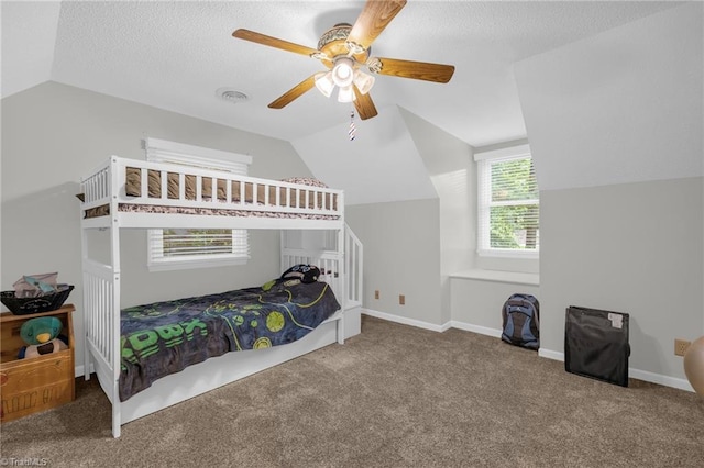 5001 Robert Andrew Rd, Greensboro, NC 27406 - bedroom featuring vaulted ceiling, carpet floors, a ceiling fan, and a textured ceiling