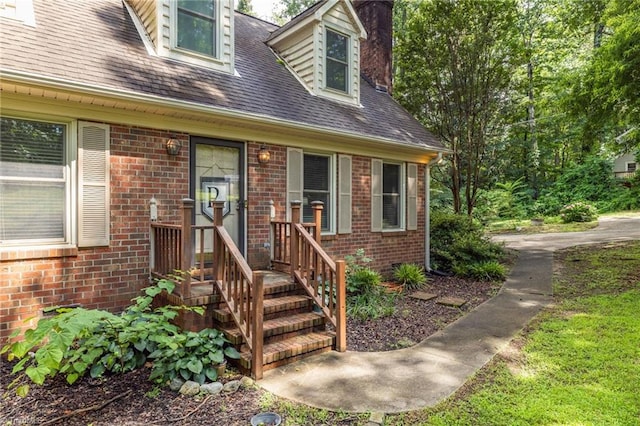 5001 Robert Andrew Rd, Greensboro, NC 27406 - entrance to property with brick siding, a chimney, and roof with shingles