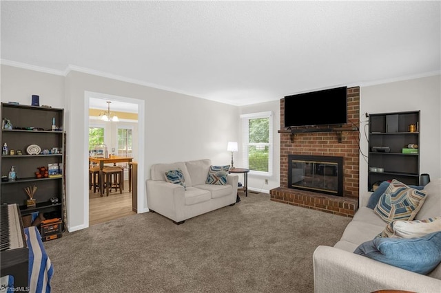 5001 Robert Andrew Rd, Greensboro, NC 27406 - living area with carpet floors, a chandelier, ornamental molding, and a brick fireplace