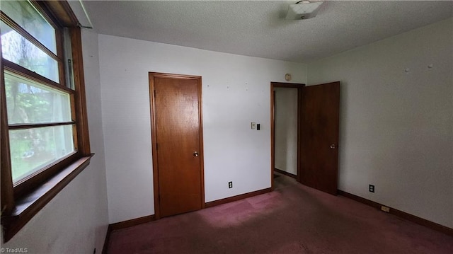 2308 Sprague St, Winston-Salem, NC 27107 - unfurnished bedroom featuring carpet floors, a textured ceiling, baseboards, and a closet
