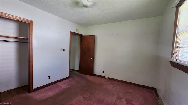 2308 Sprague St, Winston-Salem, NC 27107 - unfurnished bedroom with carpet, a textured ceiling, a closet, and baseboards
