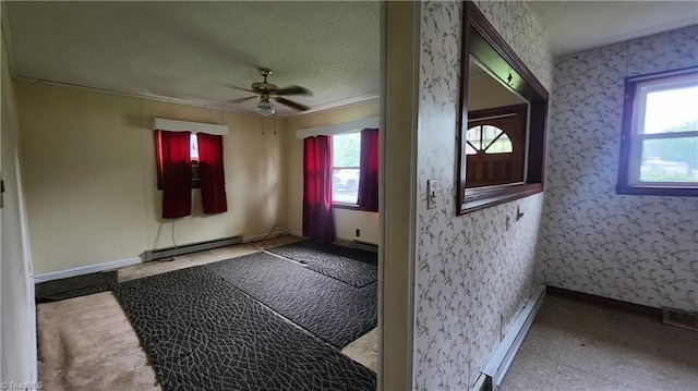 2308 Sprague St, Winston-Salem, NC 27107 - entrance foyer featuring plenty of natural light, baseboard heating, ceiling fan, wallpapered walls, and ornamental molding