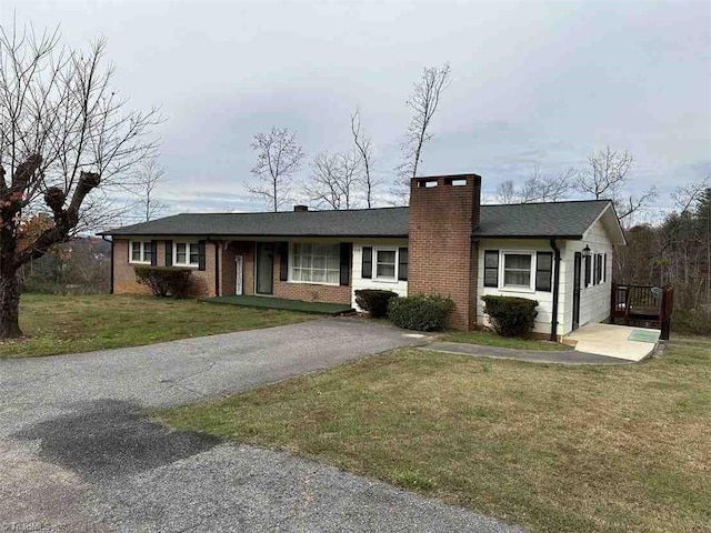 210 Grinton Ave, Wilkesboro, NC 28697 - ranch-style house with a chimney, asphalt driveway, and a front yard