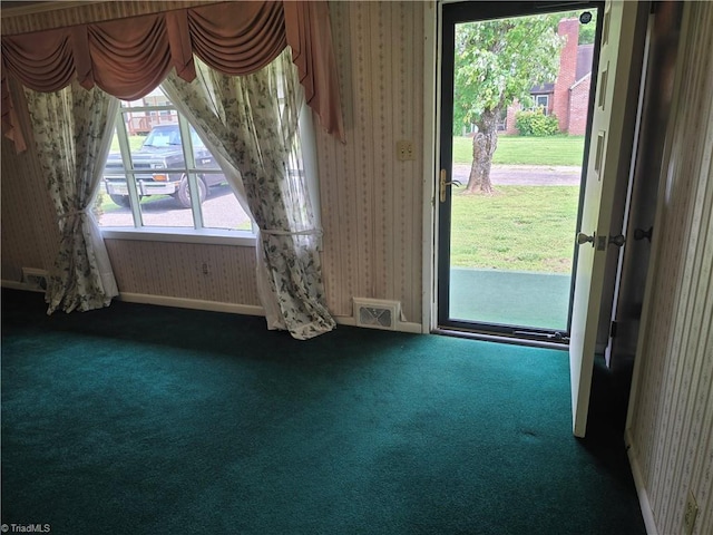 210 Grinton Ave, Wilkesboro, NC 28697 - foyer featuring carpet floors and wallpapered walls