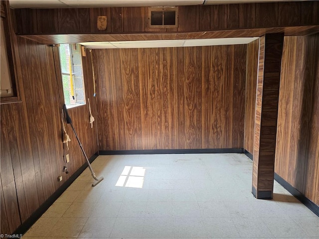 210 Grinton Ave, Wilkesboro, NC 28697 - empty room with wooden walls, light floors, and baseboards