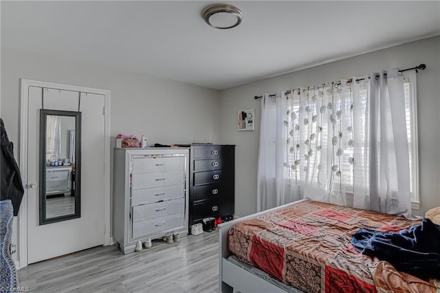 bedroom with light wood-type flooring