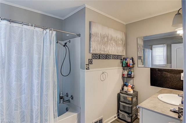 full bathroom with vanity, crown molding, visible vents, and shower / tub combo