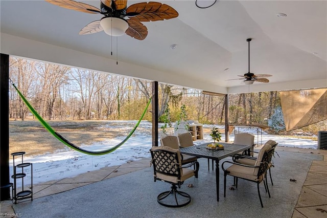 view of patio featuring ceiling fan and outdoor dining space