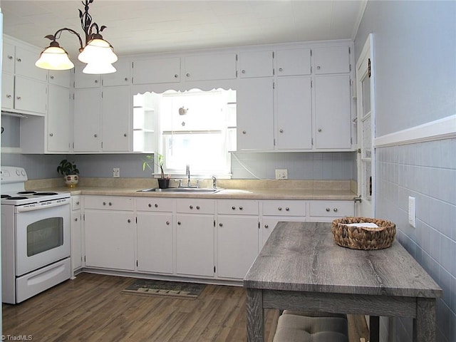 kitchen with a sink, dark wood finished floors, white cabinets, and white range with electric cooktop