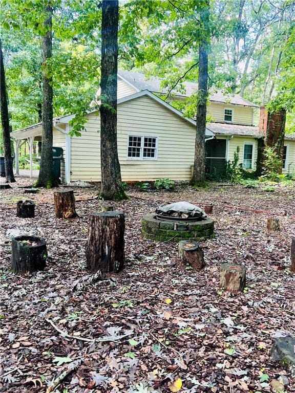 view of yard with an outdoor fire pit