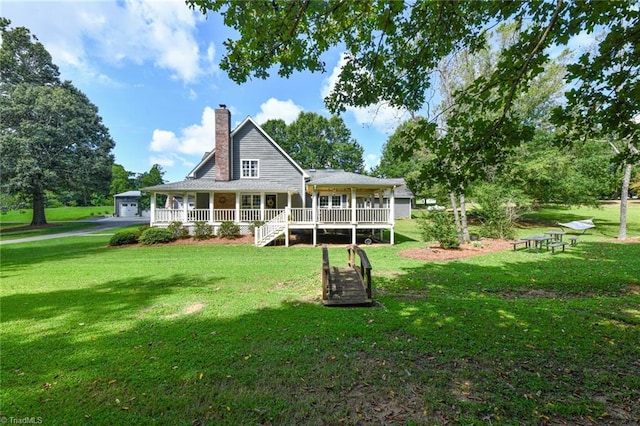 rear view of property with a lawn