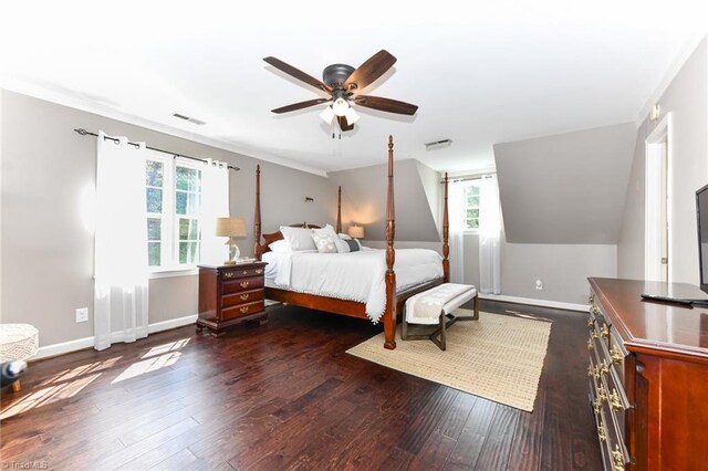 bedroom featuring dark wood-type flooring, ceiling fan, and multiple windows