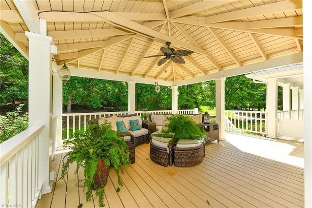 wooden terrace featuring ceiling fan and a gazebo