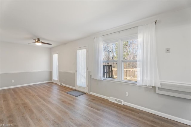 interior space featuring ceiling fan and light hardwood / wood-style floors