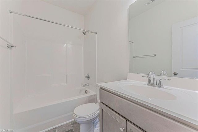 full bathroom featuring tile floors, toilet, vanity, and bathtub / shower combination