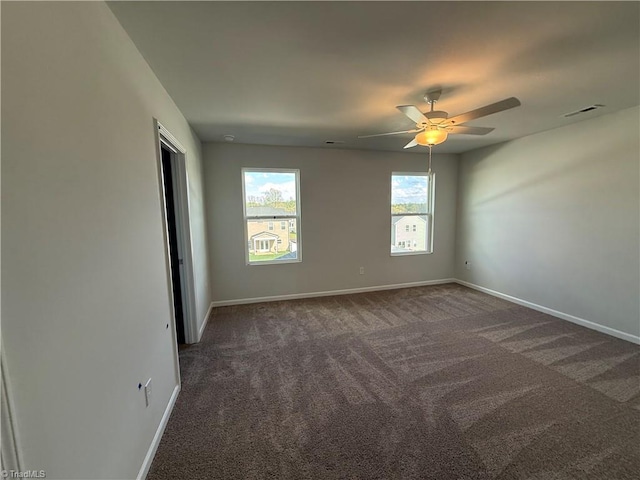 2557 Raspberry Hill Dr, Winston-Salem, NC 27106 - carpeted empty room with baseboards, visible vents, and ceiling fan