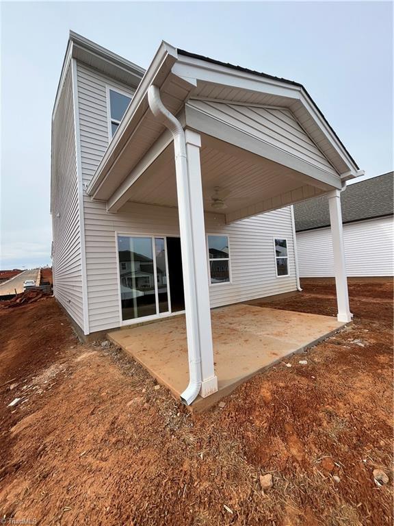 rear view of property featuring a patio area